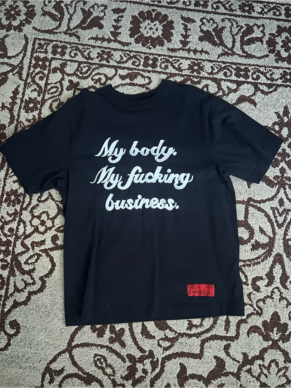 CHNGE Black Tee with White Script Slogan and Red Patch